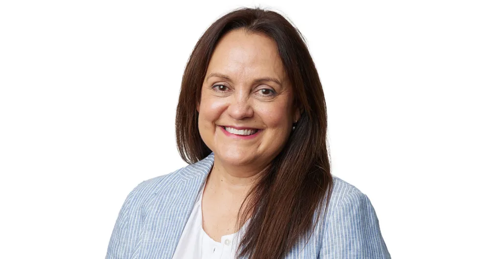 Cathie McBean wearing a blue collared shirt