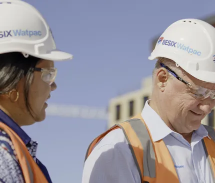 Medium Close Up View Of Besix Watpack Project Manager Glen Watson And Indigenous Employee Breeane Saltner Wearing Hard Hats